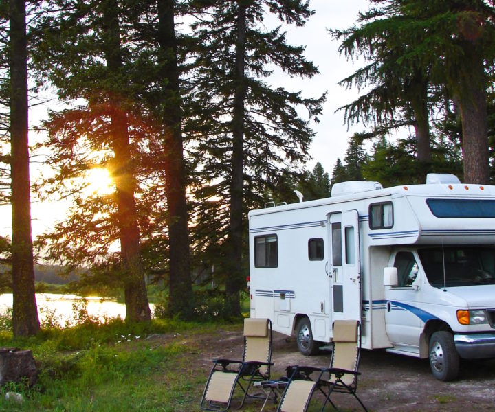 RV and chairs at secluded campsite at sunset