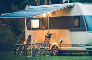 Travel Trailer Caravaning. RV Park Camping at Night